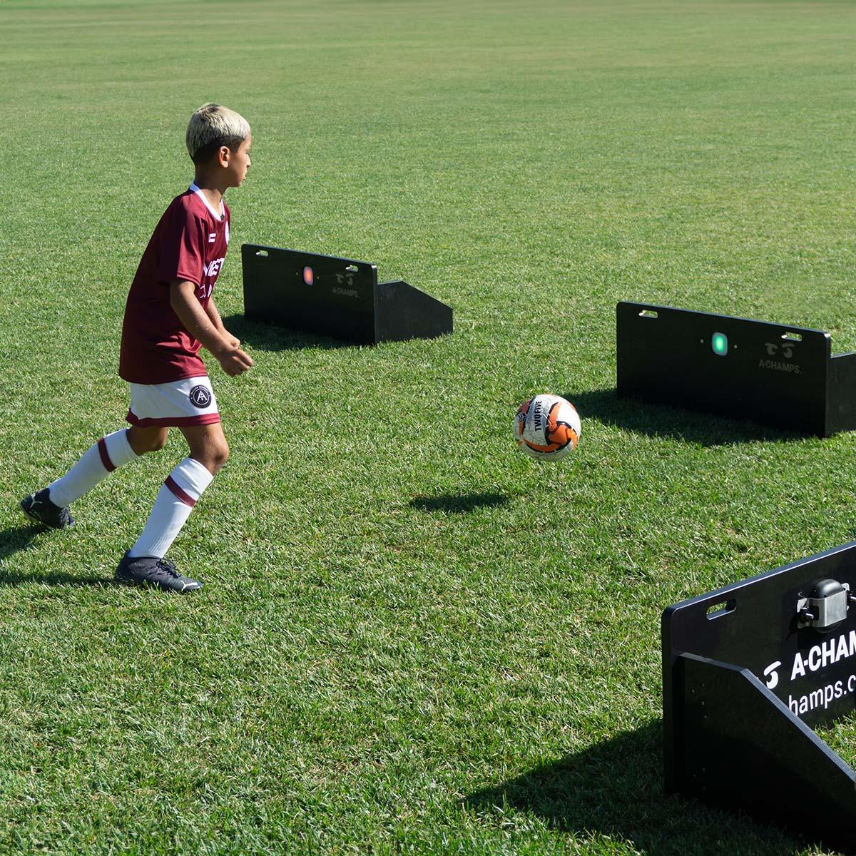 Young soccer player using the At Home Soccer Bundle to train foot skills
