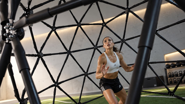 A soccer player scanning and moving to a cue inside CogniCage.