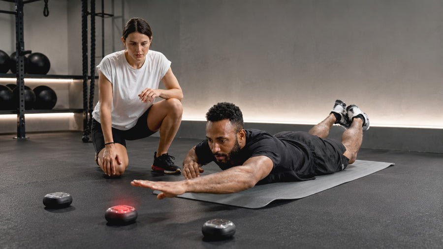 Therapist guiding a patient through a cognitive-motor rehabilitation task